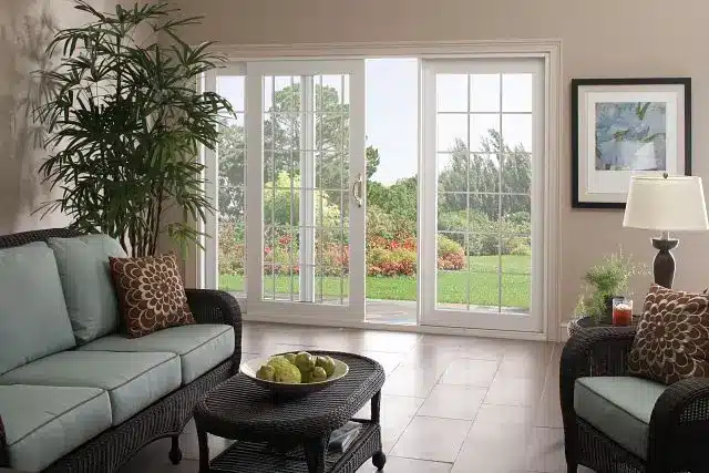 Bright living room with a patio door, stylish furniture, and a welcoming space for gatherings.