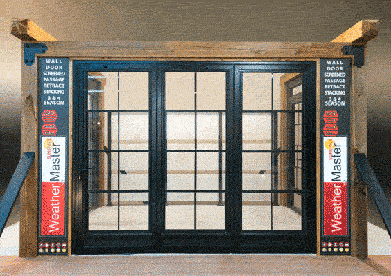 Sunspace WeatherMaster multi-panel folding glass door system display, black frame, with side panels describing its 3 and 4 season wall door, screened passage, retracting, and stacking features.