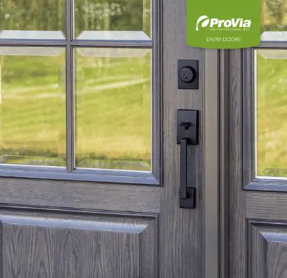Close-up of a dark wood-grain textured entry door featuring a multi-pane glass window and sleek matte black handle and deadbolt hardware.
